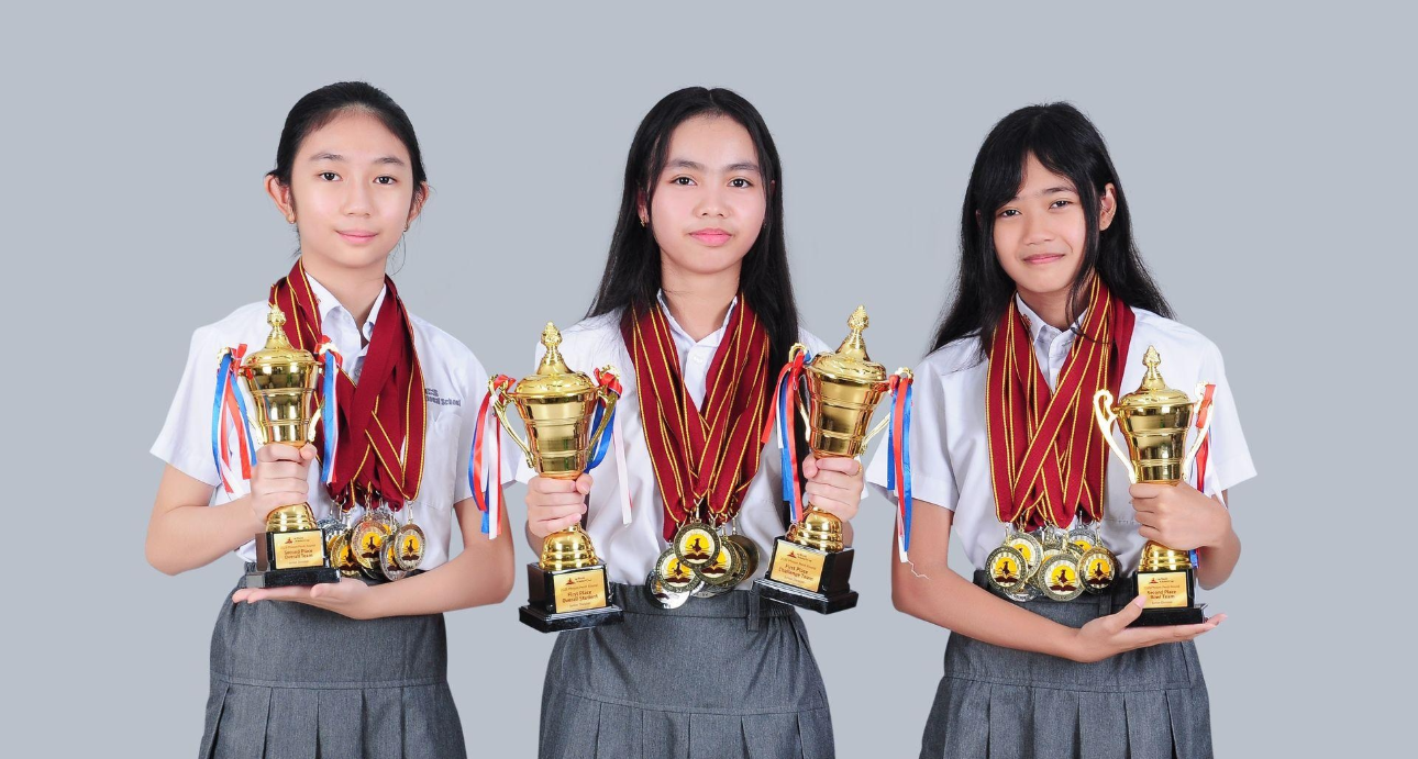 Students with championship trophies